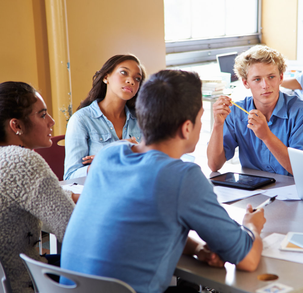 Students discussing ideas together during an active learning lesson